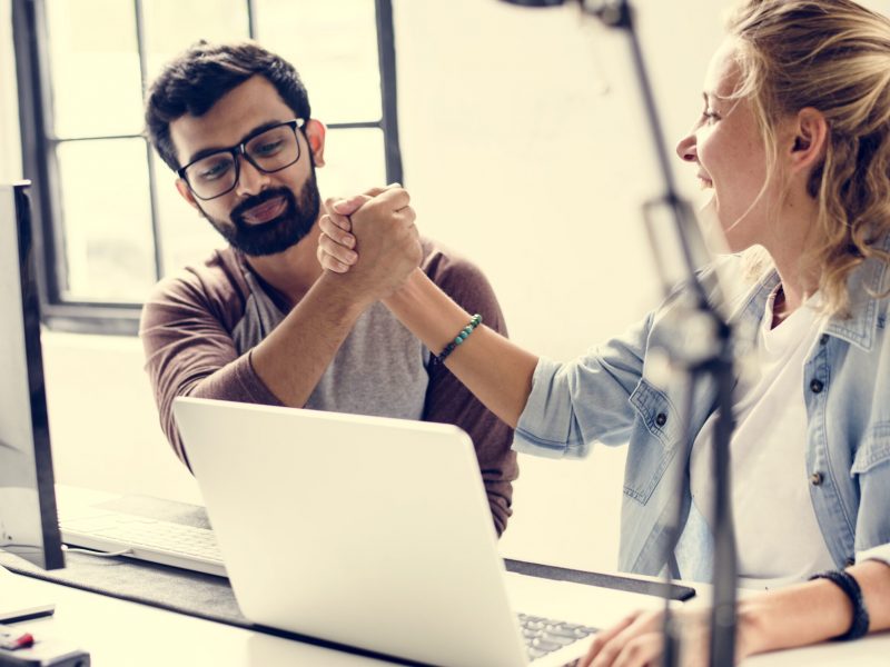 Friends holding hands together